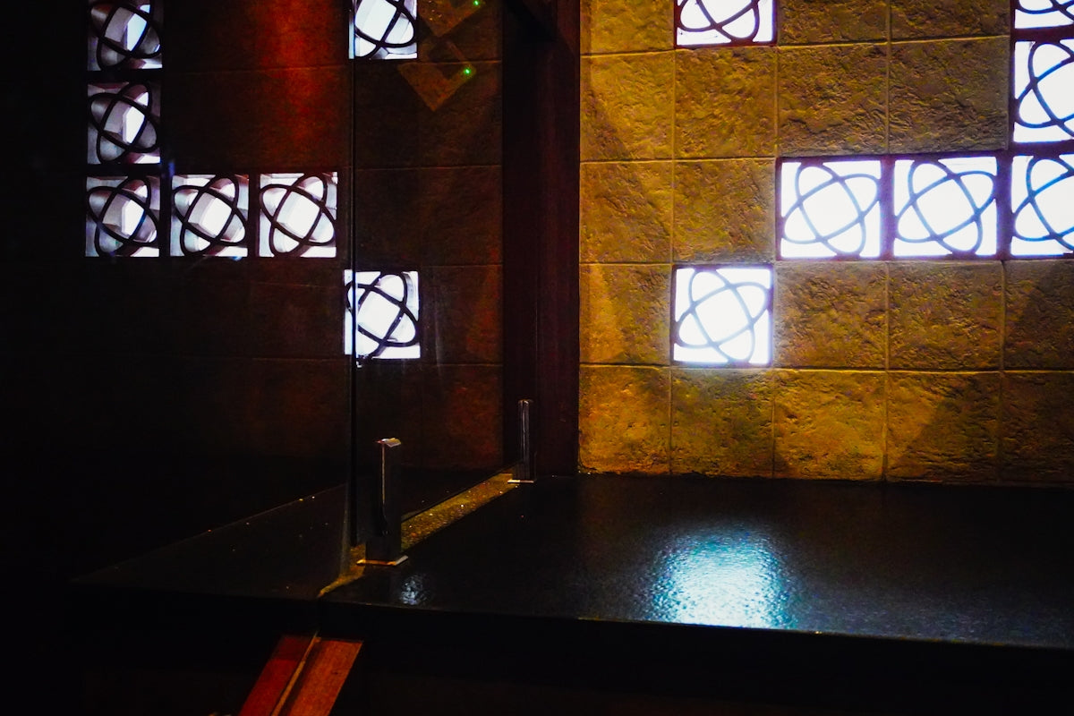Modern interior with geometric wall lights and shadows